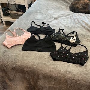 5 PINK xs sports bras. 2 never worn.
